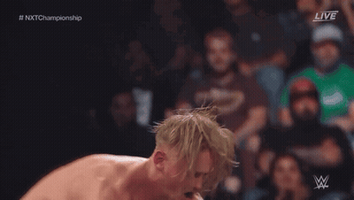 Wrestler Jumping Over Another In Ring With Referee GIF