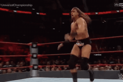 Wrestler Kicking Another Wrestler In Ring GIF