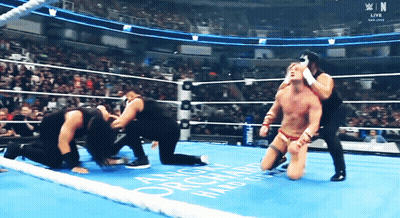 Wrestler Kneeling In Ring With Orchard GIF