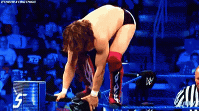Wrestler Kneeling In Ring With Referee GIF