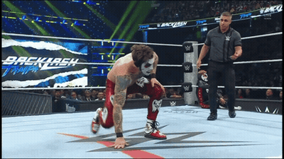 Wrestler Kneeling In Wrestling Ring With Backlash GIF