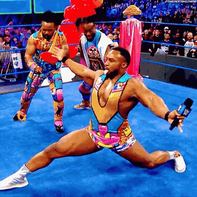 Wrestler Kneeling With Microphone GIF