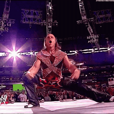 Wrestler Kneeling With Mouth Open In Front Of XII Sign GIF