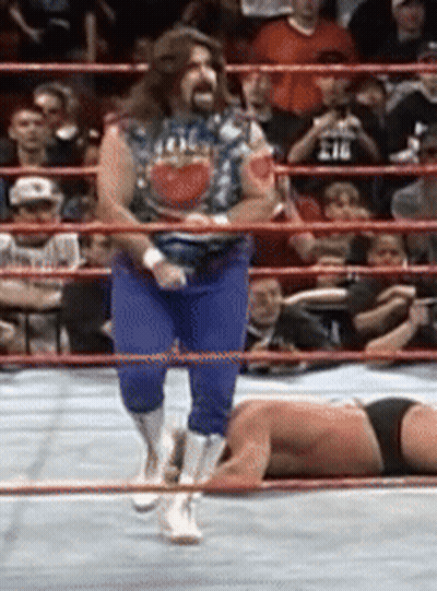 Wrestler Laying On Ground, Man Standing GIF