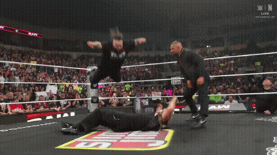Wrestler Laying On Ring With Smackdown Logo GIF