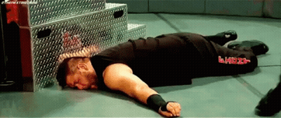 Wrestler Lying in Wrestling Ring