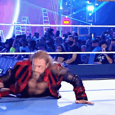 Wrestler Lying On Ground Before Crowd GIF