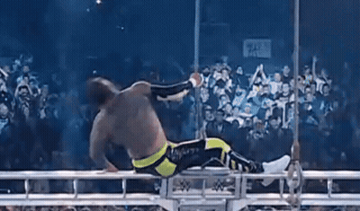 Wrestler Lying On Rope In Ring GIF