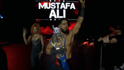Wrestler Mustafa Ali Holding Wrestling Belt GIF