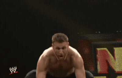 Wrestler Sitting In Front Of Sign N GIF
