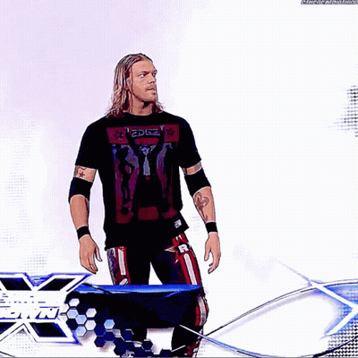 Wrestler Standing In Front Of Edge Sign GIF
