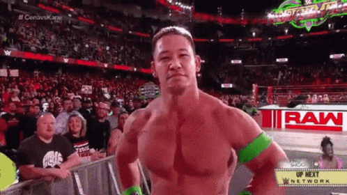 Wrestler Standing In Ring With Raw Logo GIF