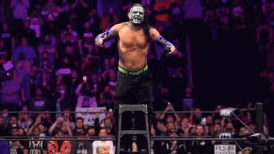 Wrestler Standing On Ladder In Front Of Crowd GIF