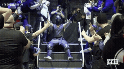 Wrestler Standing On Stairs Surrounded By Fans GIF