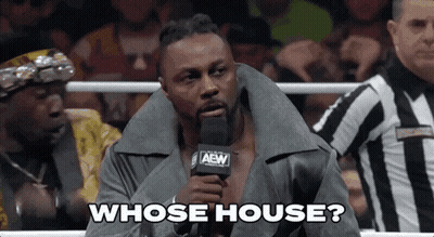 Wrestler Talking Into Microphone With Referee GIF