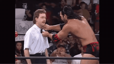 Wrestler Tying Referee's Neck GIF