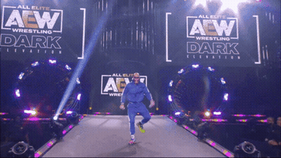 Wrestler Walking Down Aisle In Front Of AEW Sign GIF