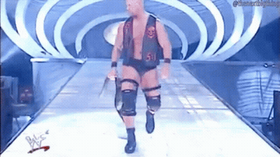 Wrestler Walking Down Ramp Holding Sword GIF
