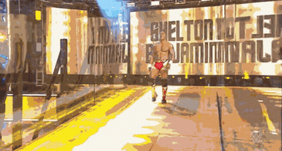 Wrestler Walking Past Shelton Sign GIF