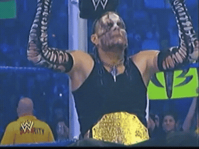 Wrestler With Arms Up Wearing WWE Championship Belt GIF