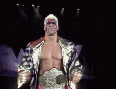 Wrestler With Belt Standing In Darkness GIF