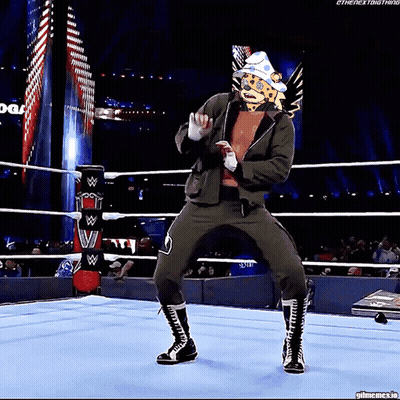 Wrestler With Cheetah Head Dancing In Ring GIF