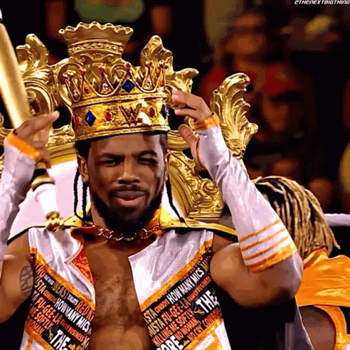 Wrestler With Crown In White And Orange Outfit GIF
