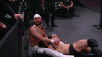 Wrestler With Head Bandage Lying With Another GIF