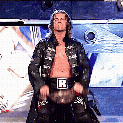 Wrestler With Letter R On Belt On Stage GIF