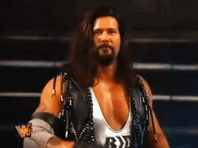 Wrestler With Long Hair And Beard In White Tank Top With Letter B GIF