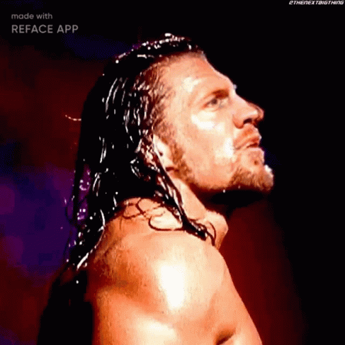 Wrestler With Long Hair And Beard Standing In Dark GIF