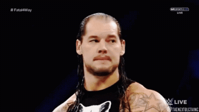 Wrestler With Long Hair And Cat Shirt In Ring GIF