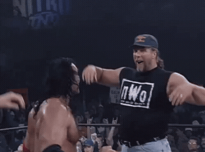 Wrestler With Long Hair Standing In Ring Mouth Open GIF