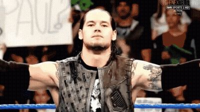 Wrestler With Sign Saying Paul GIF