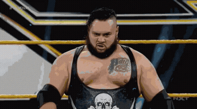 Wrestler With Skull On Chest In Ring GIF