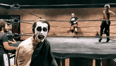 Wrestler With Zombie Face Paint GIF