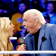 Wrestlers Charlotte Flair And Ric Flair Woo Together GIF