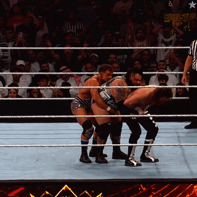 Wrestlers In A Ring With A Sign Behind Them That Says ' Ecw ' On It GIF