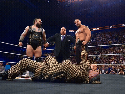 Wrestlers In A Ring With RAW On Wall GIF