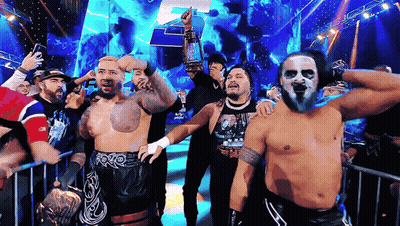Wrestlers In Front Of Crowd One Wearing WWE Shirt GIF