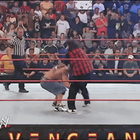 Wrestlers In Front Of RAW Sign GIF