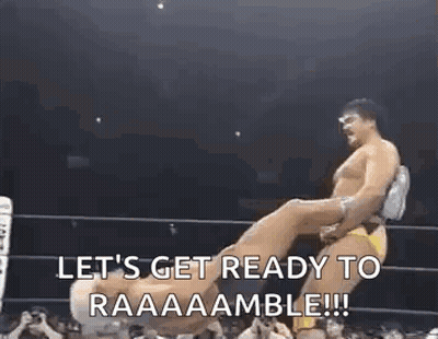 Wrestlers In Ring One Carrying Other GIF