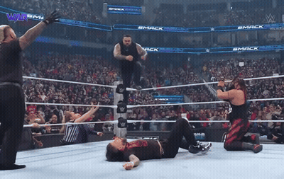 Wrestlers In Ring With Mack On Walls GIF