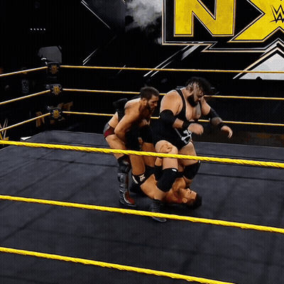 Wrestlers In Ring With N On Wall GIF