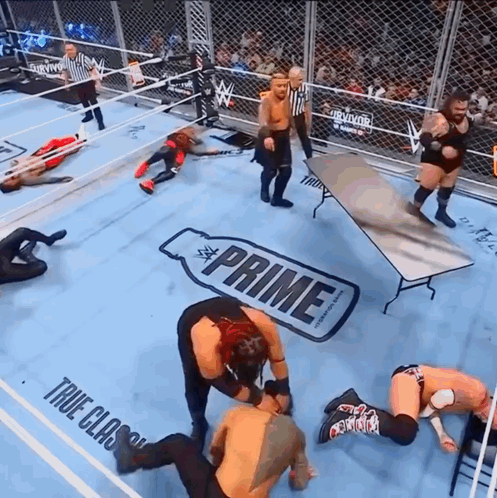 Wrestlers In Ring With Prime Table GIF