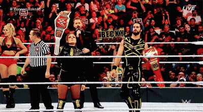 Wrestlers In Ring With Referee And Becky Sign GIF