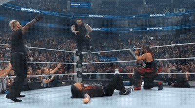 Wrestlers In Ring With Smack Sign GIF