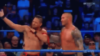 Wrestlers In Ring With World Heavyweight Championship Belt GIF