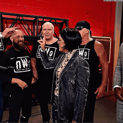 Wrestlers Posing One Wearing NW Shirt GIF