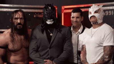 Wrestlers Posing With Mask Number 999 GIF
